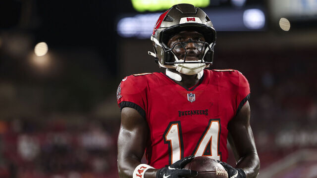TAMPA, FLORIDA - OCTOBER 21: Chris Godwin #14 of the Tampa Bay Buccaneers warms up prior to an NFL football game against the Baltimore Ravens at Raymond James Stadium on October 21, 2024 in Tampa, Florida.