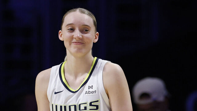LOS ANGELES, CALIFORNIA - AUGUST 20: Paige Bueckers #5 of the Dallas Wings reacts as she waits for the start of play in front of the Los Angeles Sparks bench during an 81-80 Los Angeles Sparks win over the Dallas Wings at Crypto.com Arena on August 20, 2025 in Los Angeles, California.