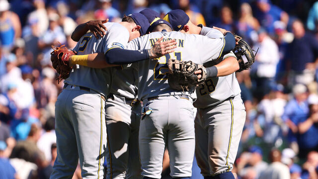 CHICAGO, ILLINOIS - AUGUST 21: The Milwaukee Brewers celebrate after their 4-1 win against the Chicago Cubs at Wrigley Field on August 21, 2025 in Chicago, Illinois.
