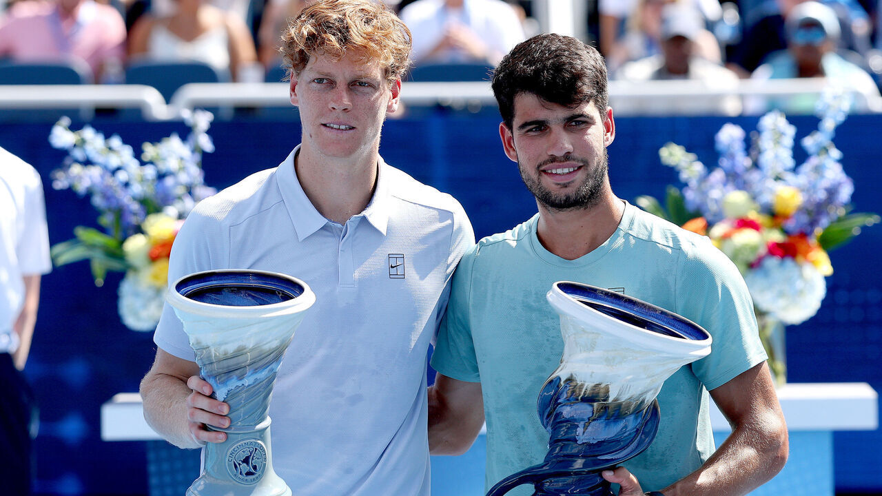 MASON, OHIO - AUGUST 18: Jannik Sinner of Italy and Carlos Alcaraz of Spain pose with their Rookwood Cups after the men's final of the Cincinnati Open at Lindner Family Tennis Center on August 18, 2025 in Mason, Ohio.