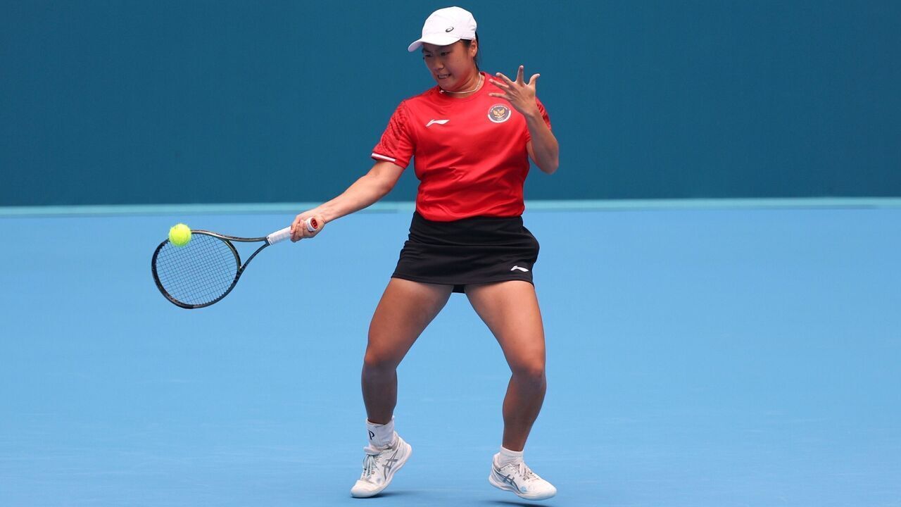 Janice Tjen of Indonesia competes during the Women's Singles Round match of Tennis between Zhu Lin of China and Janice Tjen of Indonesia at the 19th Asian Games in Hangzhou, east China's Zhejiang Province, Sept. 26, 2023.