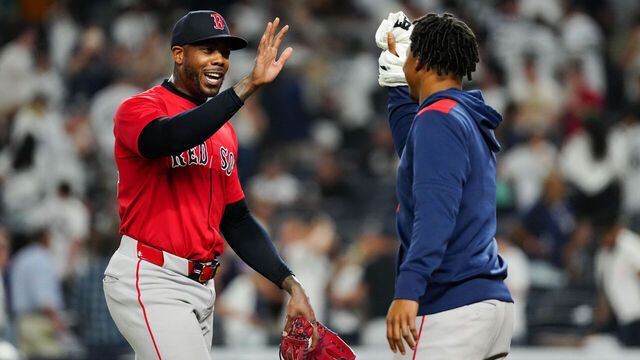 NEW YORK, NY - AUGUST 22: Aroldis Chapman #44 of the Boston Red Sox celebrates with Brayan Bello #66 after defeating the New York Yankees at Yankee Stadium on Friday, August 22, 2025 in New York, New York.