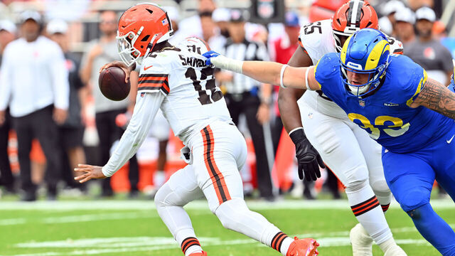 CLEVELAND, OHIO - AUGUST 23: Quarterback Shedeur Sanders #12 of the Cleveland Browns is sacked by defensive tackle Jack Heflin #93 of the Los Angeles Rams during the second half of an NFL Preseason 2025 game at Huntington Bank Field on August 23, 2025 in Cleveland, Ohio. The Browns defeated the Rams 19-17.