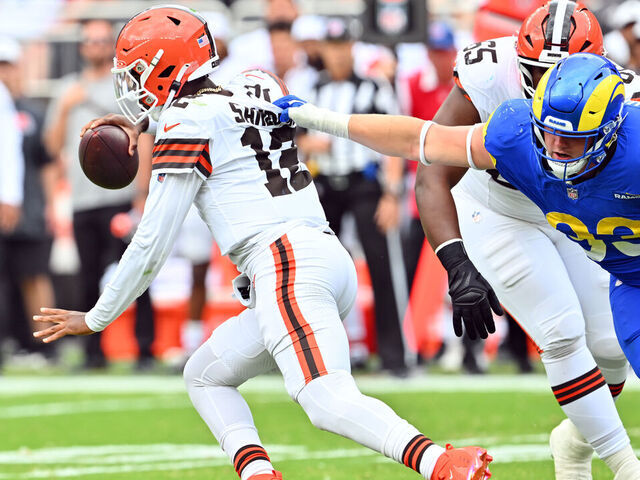 CLEVELAND, OHIO - AUGUST 23: Quarterback Shedeur Sanders #12 of the Cleveland Browns is sacked by defensive tackle Jack Heflin #93 of the Los Angeles Rams during the second half of an NFL Preseason 2025 game at Huntington Bank Field on August 23, 2025 in Cleveland, Ohio. The Browns defeated the Rams 19-17.