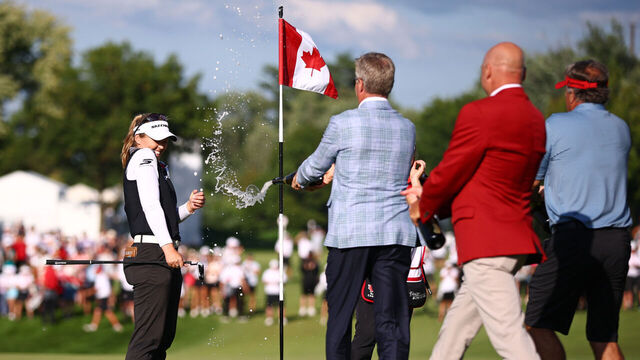 MISSISSAUGA, ONTARIO - AUGUST 24: Brooke M. Henderson of Canada is sprayed with champagne on the 18th green after winning the CPKC Women's Open 2025 at Mississaugua Golf and Country Club on August 24, 2025 in Mississauga, Ontario.