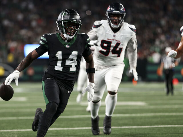 EAST RUTHERFORD, NEW JERSEY - OCTOBER 31: Malachi Corley #14 of the New York Jets fumbles the ball on the one-yard line during the first half of an NFL football game against the Houston Texans, at MetLife Stadium on October 31, 2024 in East Rutherford, New Jersey.