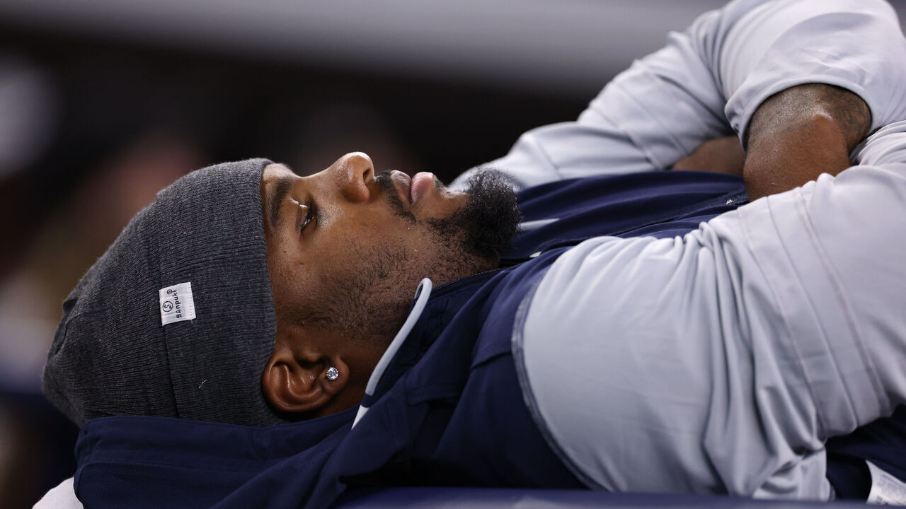 ARLINGTON, TEXAS - AUGUST 22: Micah Parsons #11 of the Dallas Cowboys lays on a training table during the second half of the NFL Preseason 2025 game against the Atlanta Falcons at AT&T Stadium on August 22, 2025 in Arlington, Texas.