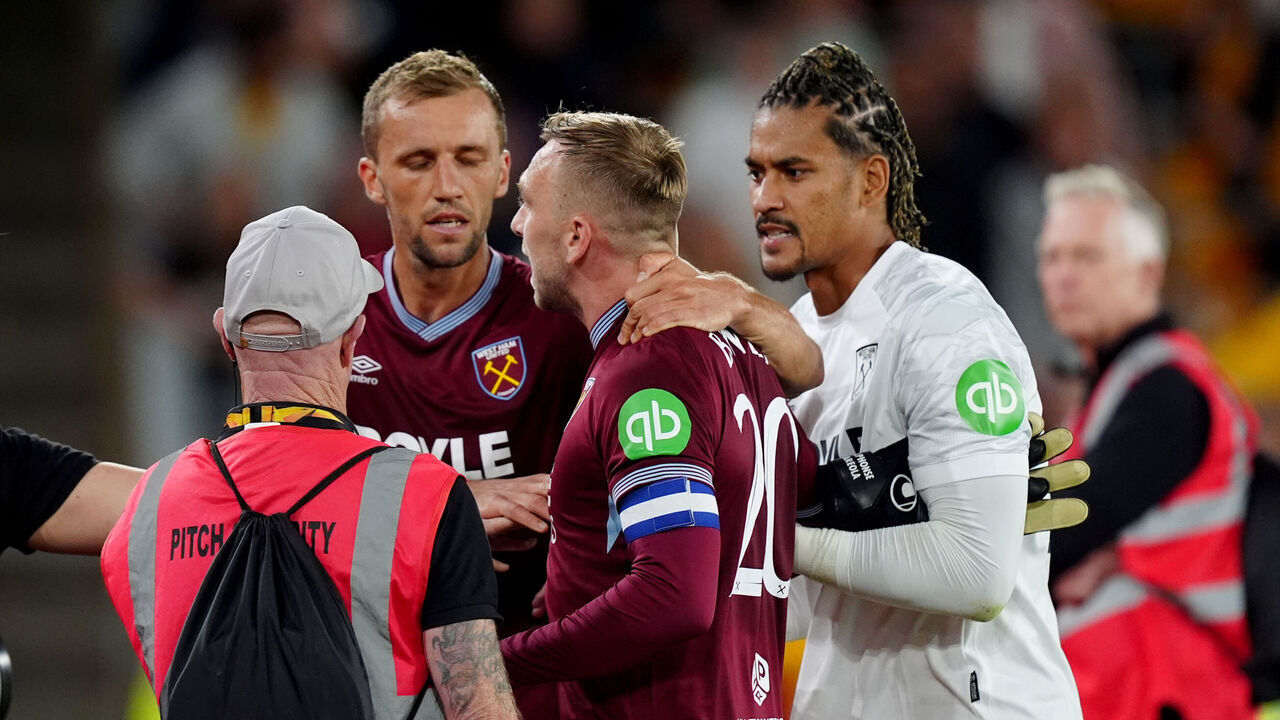 West Ham United's Jarrod Bowen being pulled away from the fans after an argument at the final whistle after the Carabao Cup second round match at Molineux Stadium, Wolverhampton. Picture date: Tuesday August 26, 2025.