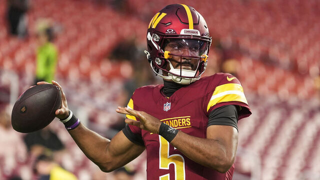 LANDOVER, MD - AUGUST 18: Jayden Daniels #5 of the Washington Commanders warms up prior to an NFL preseason football game against the Cincinnati Bengals at Northwest Stadium on August 18, 2025 in Landover, Maryland.