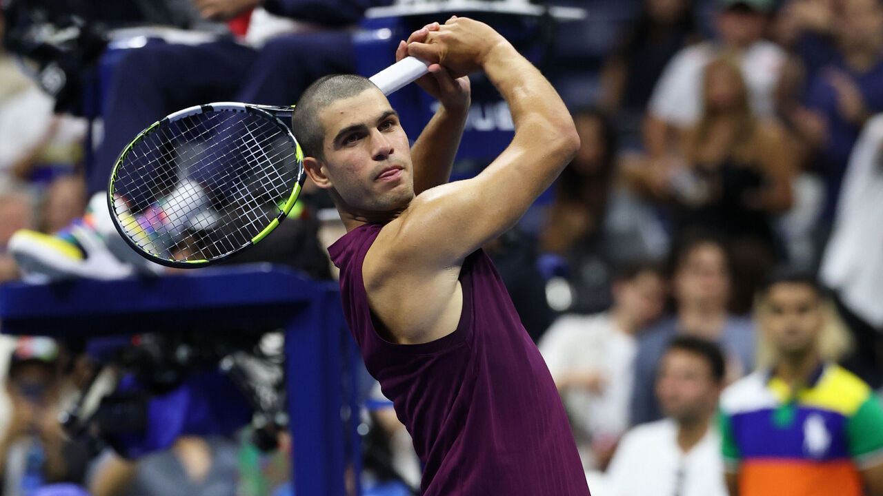 NEW YORK, NEW YORK - AUGUST 25: Carlos Alcaraz of Spain celebrates with a golf swing after defeating Reilly Opelka of the United States during their Men's Singles First Round match on Day Two of the 2025 US Open at USTA Billie Jean King National Tennis Center on August 25, 2025 in the Flushing neighborhood of the Queens borough of New York City.