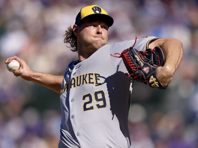 CHICAGO, ILLINOIS - AUGUST 21: Trevor Megill #29 of the Milwaukee Brewers pitches in a game against the Chicago Cubs at Wrigley Field on August 21, 2025 in Chicago, Illinois.