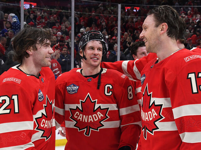 BOSTON, MASSACHUSETTS - FEBRUARY 20: Brayden Point #21, Sidney Crosby #87 and Sam Reinhart #13 of Team Canada celebrate after their 3-2 overtime win in the 4 Nations Face-Off Championship game between Team Canada and Team United States at TD Garden on February 20, 2025 in Boston, Massachusetts.