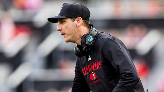 LUBBOCK, TEXAS - OCTOBER 19: Offensive coordinator Zach Kittley of the Texas Tech Red Raiders high fives a player during the first half of the game against the Baylor Bears at Jones AT&T Stadium on October 19, 2024 in Lubbock, Texas.