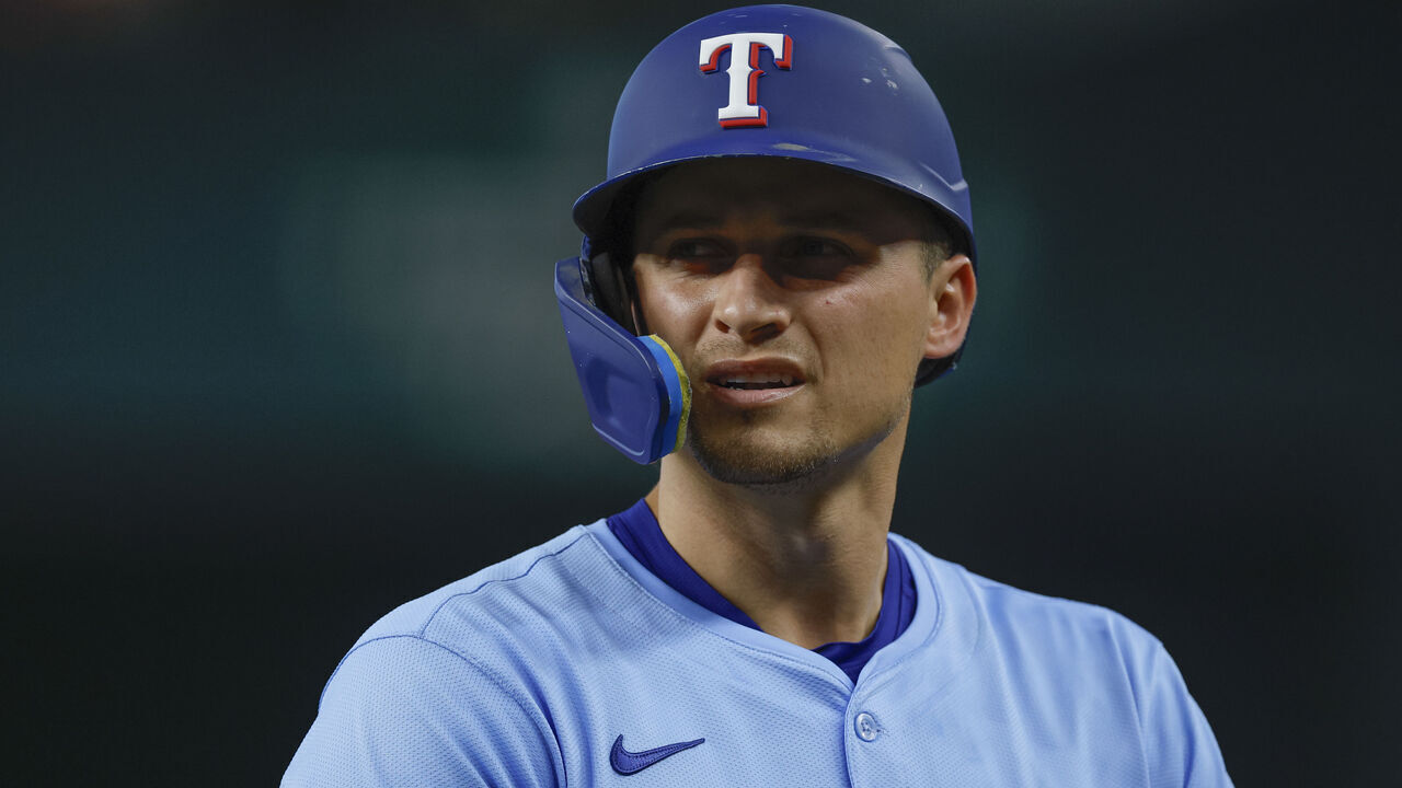 ARLINGTON, TEXAS - AUGUST 10: Corey Seager #5 of the Texas Rangers reacts after his home run was robbed in the fifth inning during a game against the Philadelphia Phillies at Globe Life Field on August 10, 2025 in Arlington, Texas.