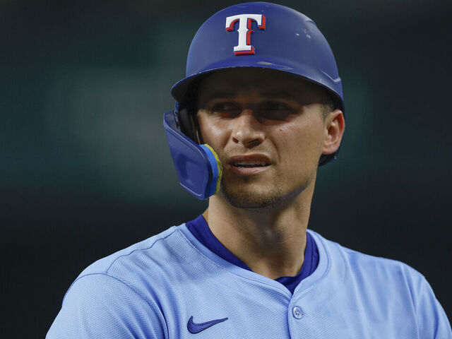 ARLINGTON, TEXAS - AUGUST 10: Corey Seager #5 of the Texas Rangers reacts after his home run was robbed in the fifth inning during a game against the Philadelphia Phillies at Globe Life Field on August 10, 2025 in Arlington, Texas.