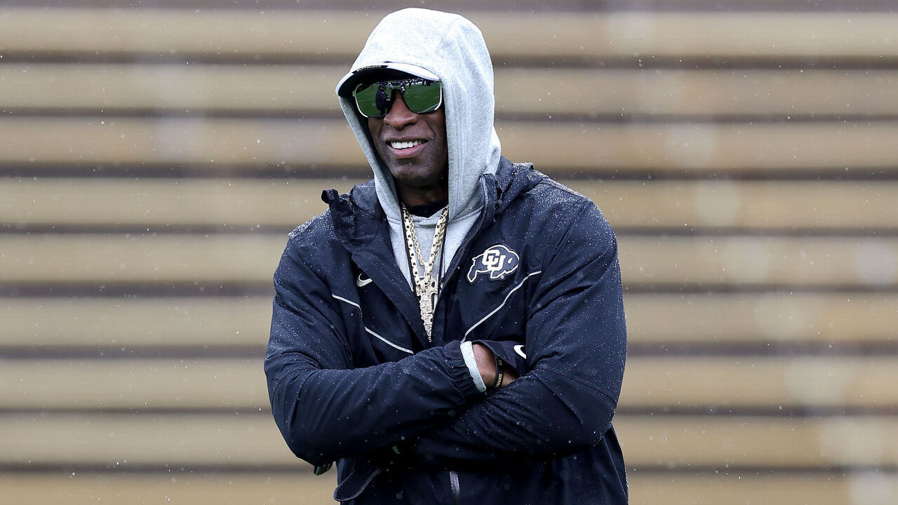 BOULDER, COLORADO - APRIL 27: Head coach Deion Sanders of the Colorado Buffaloes watches as his team warms-up prior to their spring game at Folsom Field on April 27, 2024 in Boulder, Colorado.