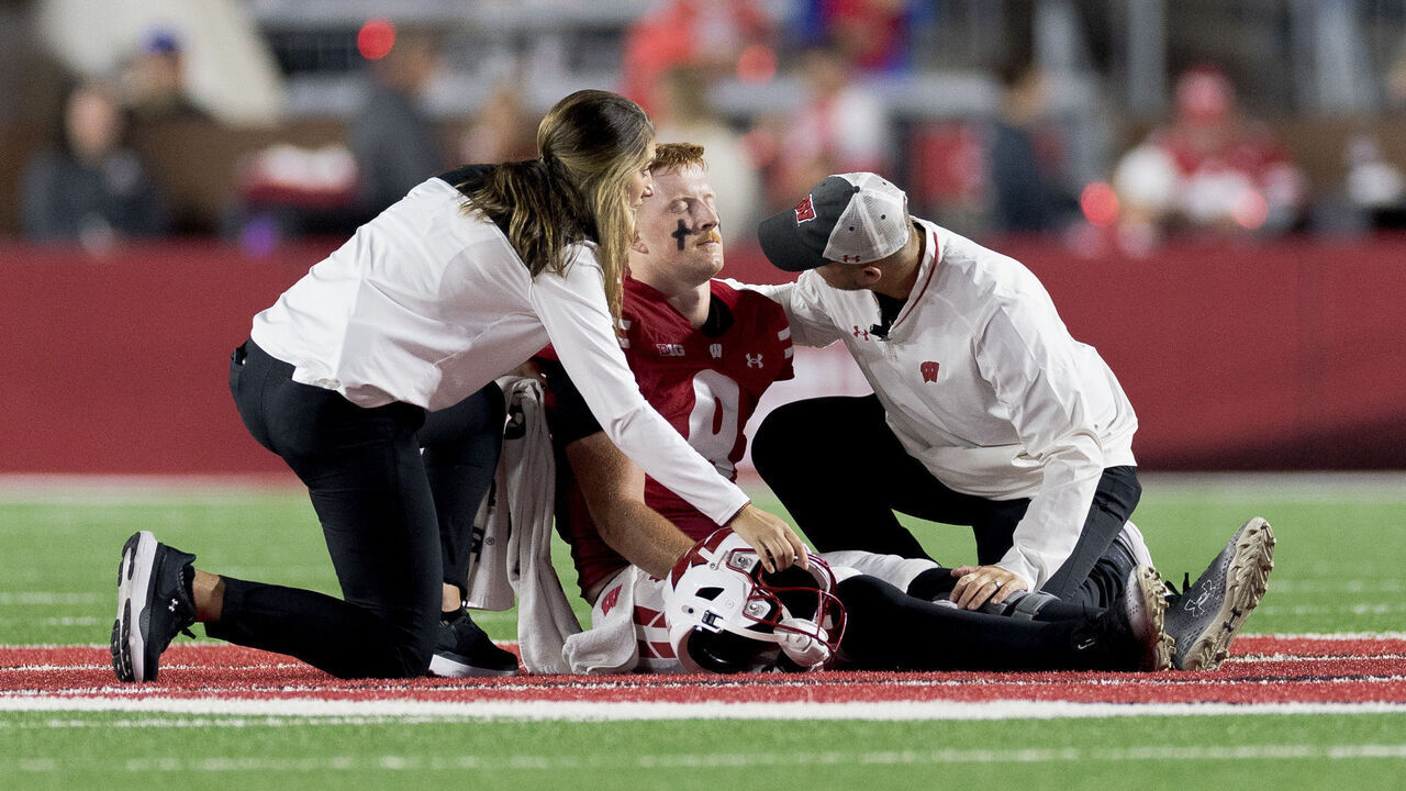 MADISON, WI - AUGUST 28: Wisconsin Badgers quarterback Billy Edwards Jr. (9) gets looked at by the trainers after going down with an injury durning a college football game between the Miami (OH) Redhawks and the Wisconsin Badgers on August 28, 2025 at Barry Alvarez field inside Camp Randall Stadium in Madison, WI.