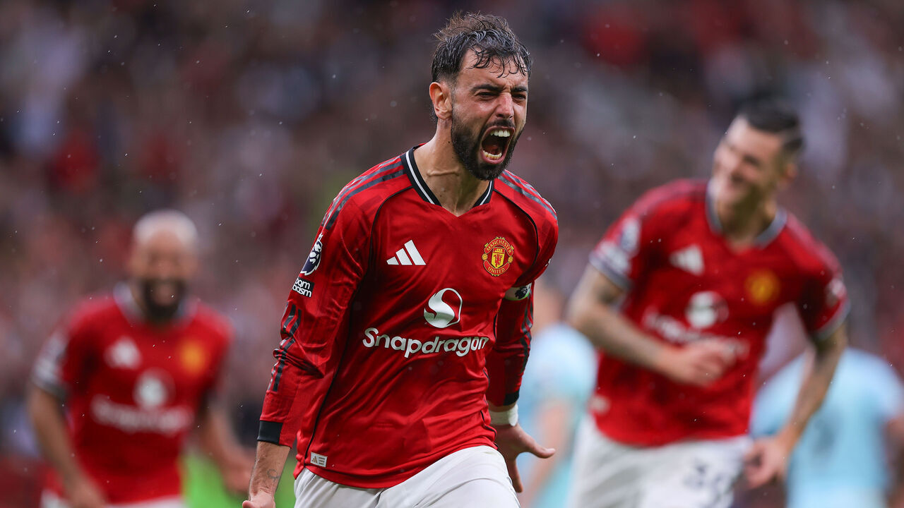 MANCHESTER, ENGLAND - AUGUST 30: Bruno Fernandes of Manchester United celebrates after scoring their side's third goal from the penalty spot during the Premier League match between Manchester United and Burnley at Old Trafford on August 30, 2025 in Manchester, England.