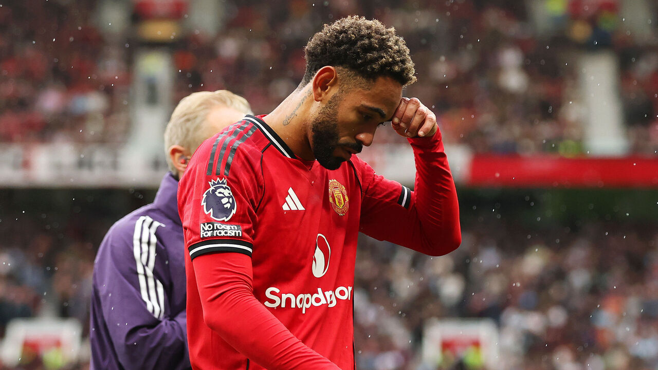 MANCHESTER, ENGLAND - AUGUST 30: Matheus Cunha of Manchester United leaves the pitch following an injury during the Premier League match between Manchester United and Burnley at Old Trafford on August 30, 2025 in Manchester, England.
