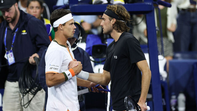 Germany's Daniel Altmaier (L) shakes hands with Greece's Stefanos Tsitsipas after winning their men's singles second round tennis match on day five of the US Open tennis tournament at the USTA Billie Jean King National Tennis Center in New York City, on August 28, 2025.