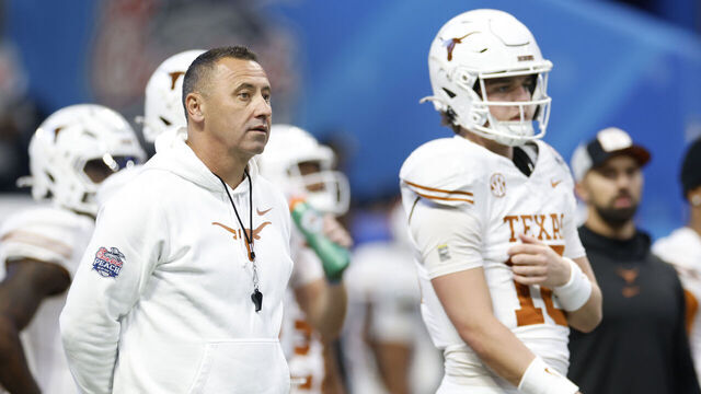 ATLANTA, GA - JANUARY 01: Head Coach Steve Sarkisian and quarterback Arch Manning #16 of the Texas Longhorns look on before the Texas Longhorns versus Arizona State Sun Devils College Football Playoff Quarterfinal at the Chick-fil-A Peach Bowl on January 1, 2025, at Mercedes-Benz Stadium in Atlanta, GA.