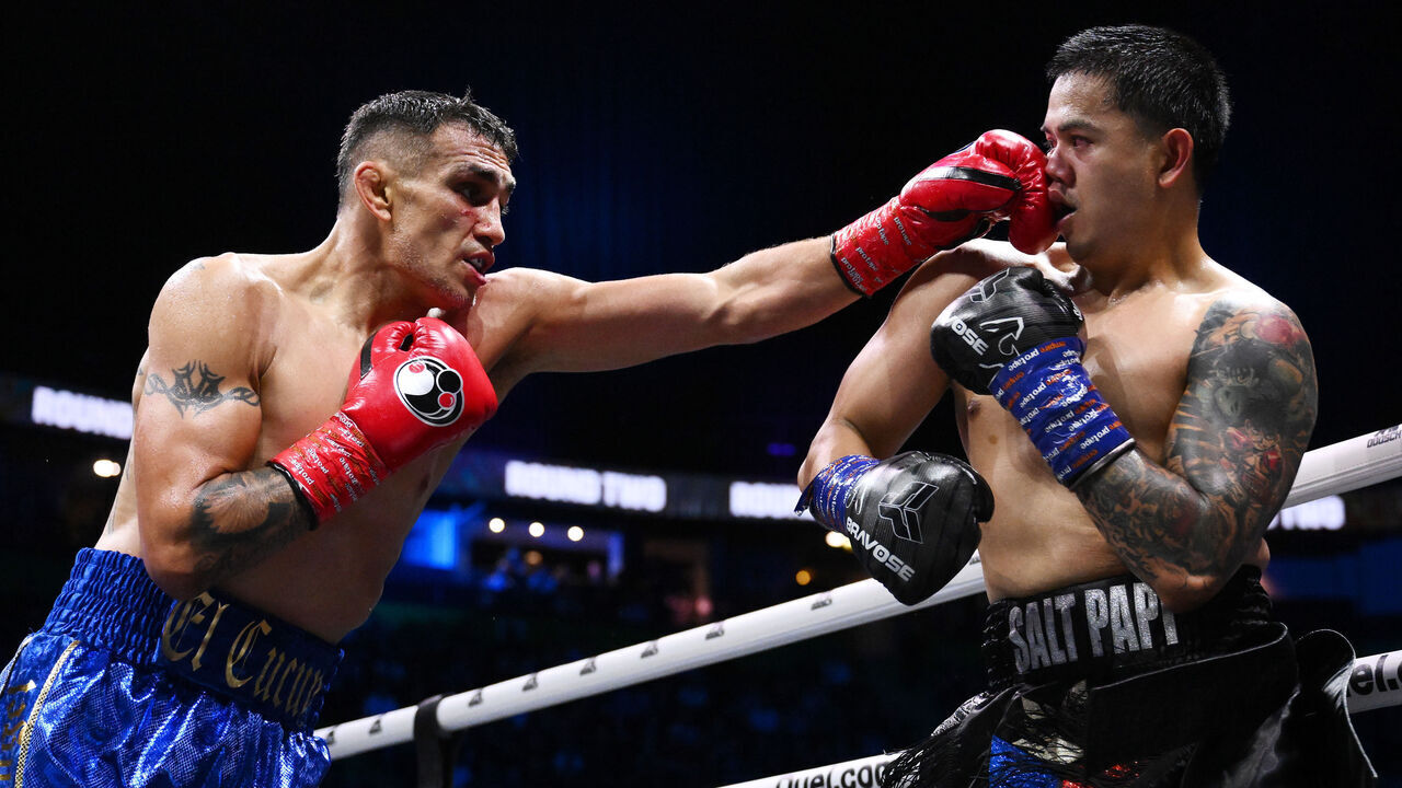 MANCHESTER, ENGLAND - AUGUST 30: Tony Ferguson punches Nathaniel Bustamant during the Middleweight fight between Tony Ferguson and Nathaniel Bustamante during the Misfits 22 - Ring of Thrones fight night at AO Arena on August 30, 2025 in Manchester, England.