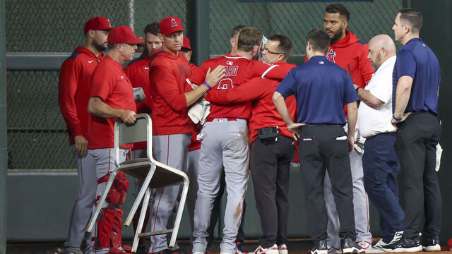 HOUSTON, TX - AUGUST 31: Los Angeles Angels left fielder Taylor Ward (3) is gets evaluated by the medical staff after hitting his face along the center field wall in the top of the eighth inning during the MLB game between the Los Angeles Angels and Houston Astros on August 31, 2025 at Daikin Park in Houston, Texas.