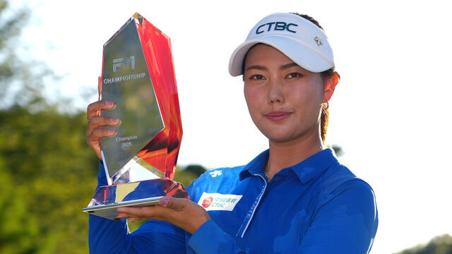 NORTON, MASSACHUSETTS - AUGUST 31: Miranda Wang of China poses with the winner's trophy after winning the FM Championship 2025 at TPC Boston on August 31, 2025 in Norton, Massachusetts.