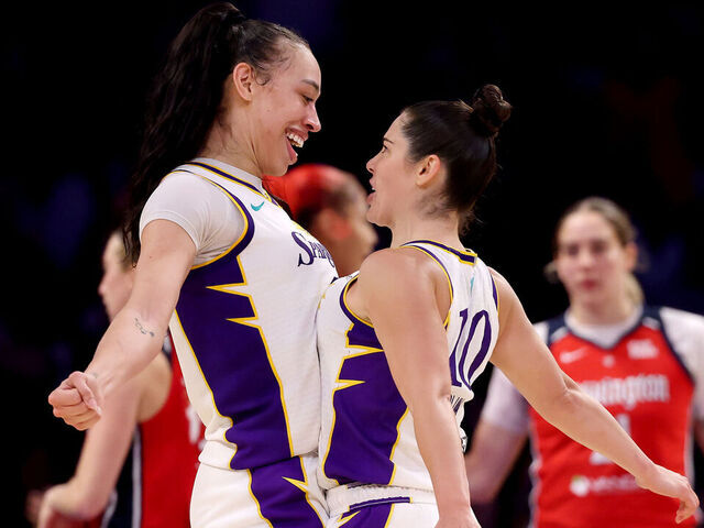 LOS ANGELES, CALIFORNIA - AUGUST 31: Dearica Hamby #5 and Kelsey Plum #10 of the Los Angeles Sparks celebrate a basket and a foul during the fourth quarter against the Washington Mystics at Crypto.com Arena on August 31, 2025 in Los Angeles, California.