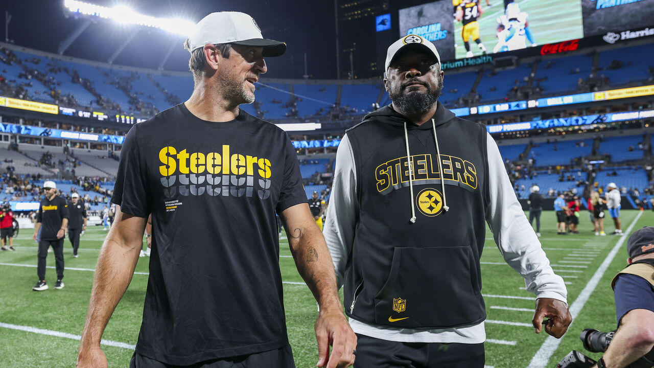 CHARLOTTE, NORTH CAROLINA - AUGUST 21: Aaron Rodgers #8 of the Pittsburgh Steelers and head coach Mike Tomlin walk off the field after a NFL Preseason 2025 game against the Carolina Panthers at Bank of America Stadium on August 21, 2025 in Charlotte, North Carolina.