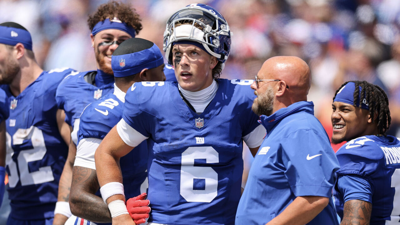ORCHARD PARK, NEW YORK - AUGUST 09: Jaxson Dart #6 of the New York Giants and head coach Brian Daboll speak during the second quarter of an NFL Preseason 2025 game between New York Giants and Buffalo Bills at Highmark Stadium on August 09, 2025 in Orchard Park, New York.