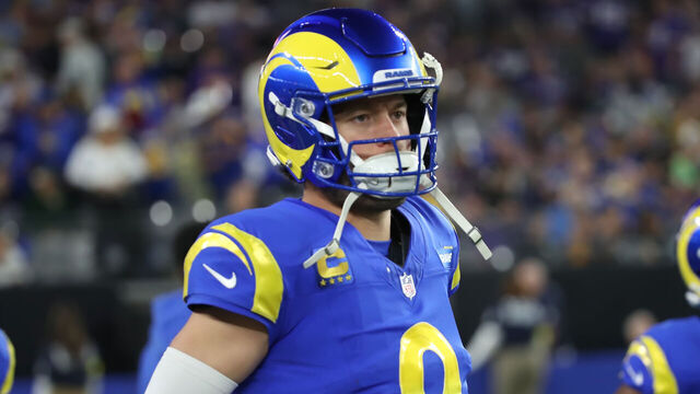 GLENDALE, ARIZONA - JANUARY 13: Quarterback Matthew Stafford #9 of the LA Rams jogs off the field to the lockerroom after the first half of the Minnesota Vikings versus Los Angeles Rams NFL Wild Card football game at State Farm Stadium on January 13, 2025 in Glendale, Arizona.