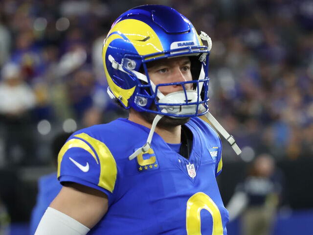 GLENDALE, ARIZONA - JANUARY 13: Quarterback Matthew Stafford #9 of the LA Rams jogs off the field to the lockerroom after the first half of the Minnesota Vikings versus Los Angeles Rams NFL Wild Card football game at State Farm Stadium on January 13, 2025 in Glendale, Arizona.