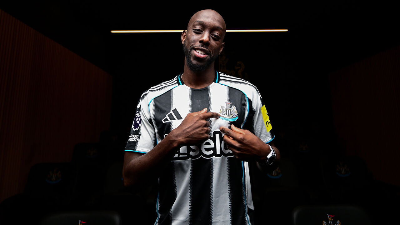 NEWCASTLE UPON TYNE, ENGLAND - SEPTEMBER 01: Yoane Wissa poses for photographs wearing a home shirt at the Newcastle United Training Centre after signing for the club on September 01, 2025 in Newcastle upon Tyne, England.