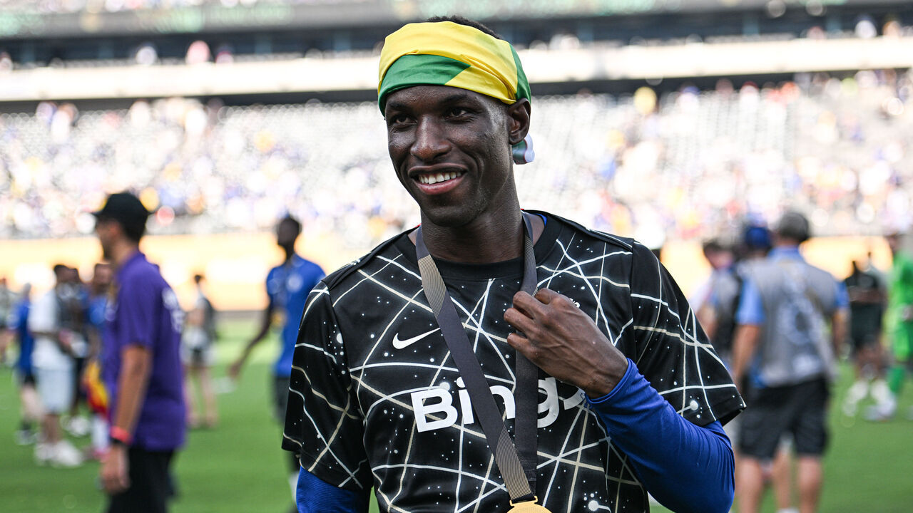 EAST RUTHERFORD, NEW JERSEY - JULY 13: Nicolas Jackson #15 of Chelsea FC walks downfield with his winners medal after the FIFA Club World Cup 2025 final match between Chelsea FC and Paris Saint-Germain at MetLife Stadium on July 13, 2025 in East Rutherford, New Jersey.
