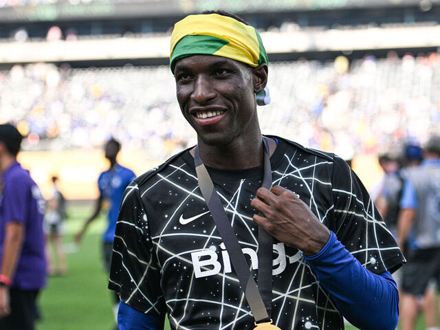 EAST RUTHERFORD, NEW JERSEY - JULY 13: Nicolas Jackson #15 of Chelsea FC walks downfield with his winners medal after the FIFA Club World Cup 2025 final match between Chelsea FC and Paris Saint-Germain at MetLife Stadium on July 13, 2025 in East Rutherford, New Jersey.