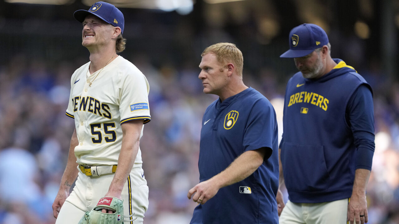 MILWAUKEE, WISCONSIN - SEPTEMBER 01: Shelby Miller #55 of the Milwaukee Brewers reacts as he walks back to the dugout after an apparent injury against the Philadelphia Phillies in the eighth inning at American Family Field on September 01, 2025 in Milwaukee, Wisconsin.