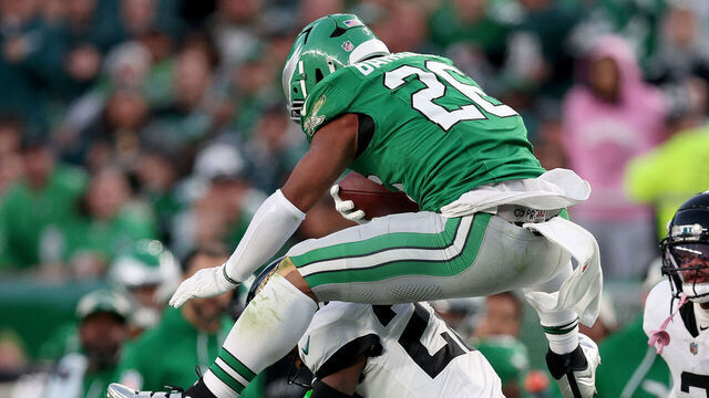 PHILADELPHIA, PENNSYLVANIA - NOVEMBER 03: Saquon Barkley #26 of the Philadelphia Eagles reverse hurdles over Jarrian Jones #22 of the Jacksonville Jaguars in the second quarter at Lincoln Financial Field on November 03, 2024 in Philadelphia, Pennsylvania.