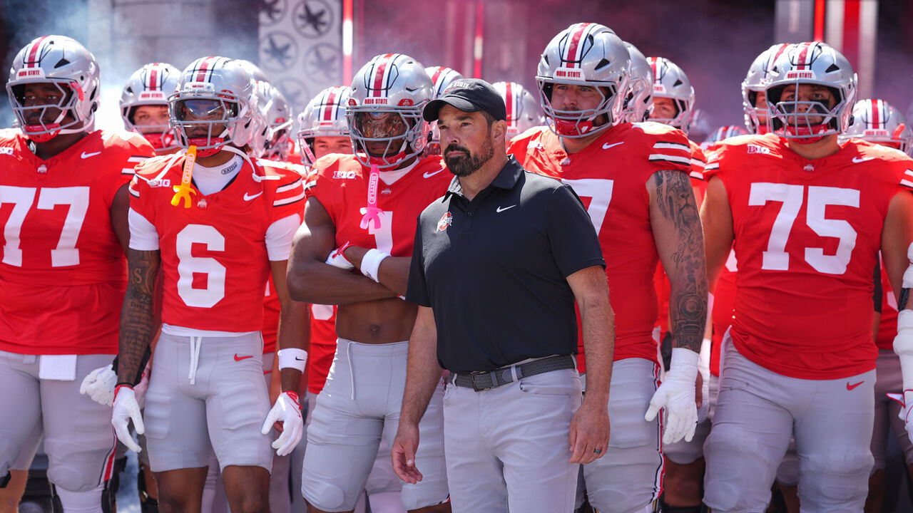 COLUMBUS, OHIO - AUGUST 30: Head coach Ryan Day of the Ohio State Buckeyes leads his team on to the field before the game against the Texas Longhorns at Ohio Stadium on August 30, 2025 in Columbus, Ohio.