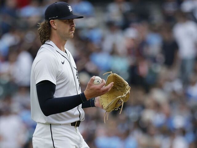 DETROIT, MI - AUGUST 23: Chris Paddack #40 of the Detroit Tigers with a new baseball while pitching against the Kansas City Royals during the second inning at Comerica Park on August 23, 2025 in Detroit, Michigan.