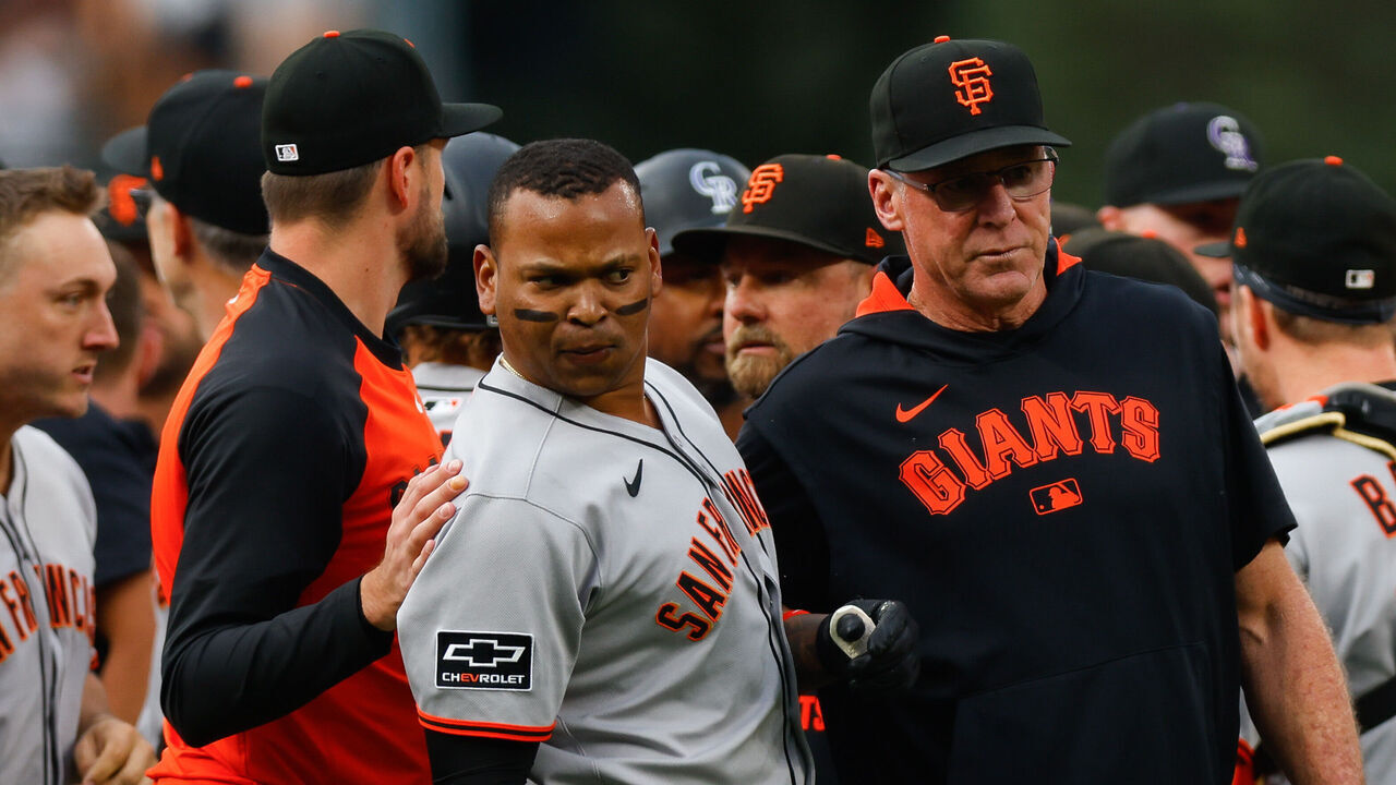 DENVER, CO - SEPTEMBER 2: Rafael Devers #16 and Manager Bob Melvin of the San Francisco Giants stand on the field during an altercation with the Colorado Rockies after Starting pitcher Kyle Freeland #21 of the Colorado Rockies took exception with Devers following a two-run home run by Devers in the first inning at Coors Field on September 2, 2025 in Denver, Colorado.