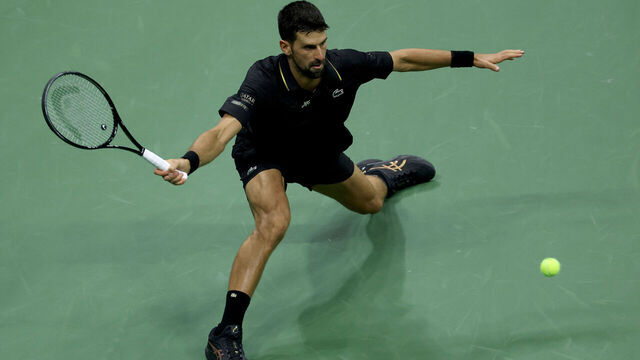 NEW YORK, NEW YORK - SEPTEMBER 02: Novak Djokovic of Serbia returns a shot to Taylor Fritz of the United States during their Men's Quarterfinal match on Day Ten of the 2025 US Open at USTA Billie Jean King National Tennis Center on September 2, 2025 in the Flushing neighborhood of the Queens borough of New York City.