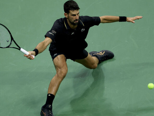 NEW YORK, NEW YORK - SEPTEMBER 02: Novak Djokovic of Serbia returns a shot to Taylor Fritz of the United States during their Men's Quarterfinal match on Day Ten of the 2025 US Open at USTA Billie Jean King National Tennis Center on September 2, 2025 in the Flushing neighborhood of the Queens borough of New York City.