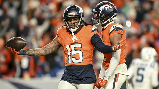 DENVER, CO - DECEMBER 15: Nik Bonitto (15) of the Denver Broncos celebrates housing a pick-six on a pass thrown by Adonai Mitchell (10) of the Indianapolis Colts intended for Anthony Richardson (5) as Pat Surtain II (2) joins in the fun during the fourth quarter at Empower Field at Mile High in Denver on Sunday, December 15, 2024.