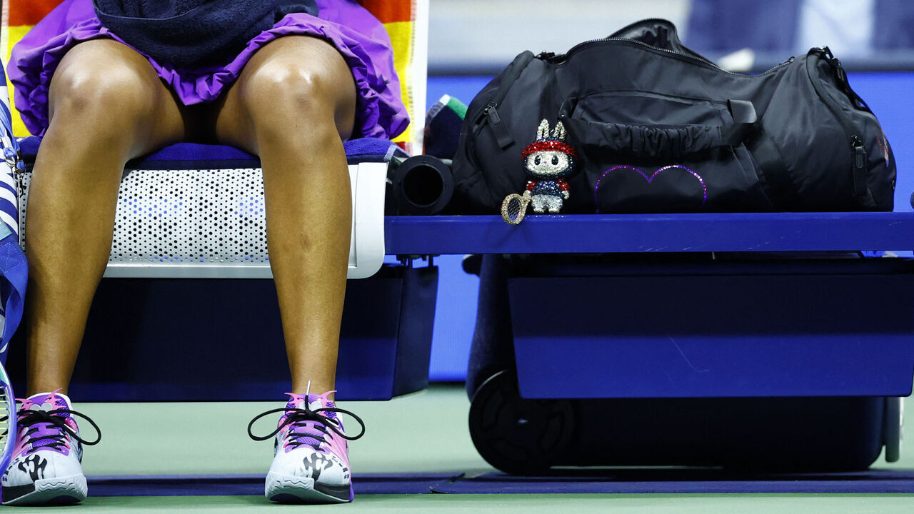 A bedazzled labubu-style doll is seen on the bag of Japan's Naomi Osaka ahead of her women's singles semifinal tennis match against USA's Amanda Anisimova on day twelve of the US Open tennis tournament at the USTA Billie Jean King National Tennis Center in New York City, on September 4, 2025.