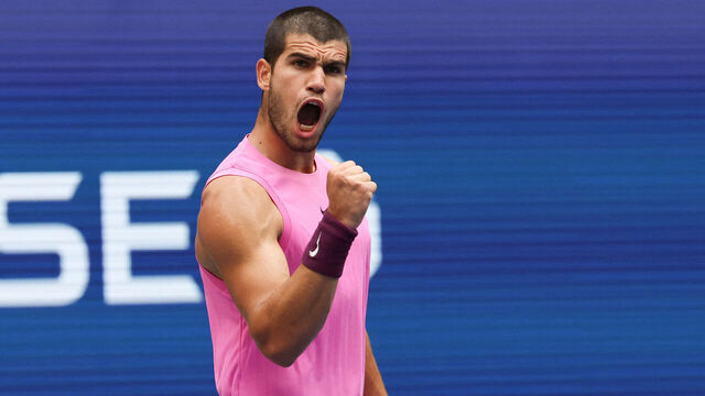 Spain's Carlos Alcaraz reacts to a point to Serbia's Novak Djokovic during their men's singles semifinal tennis match on day thirteen of the US Open tennis tournament at the USTA Billie Jean King National Tennis Center in New York City, on September 5, 2025.