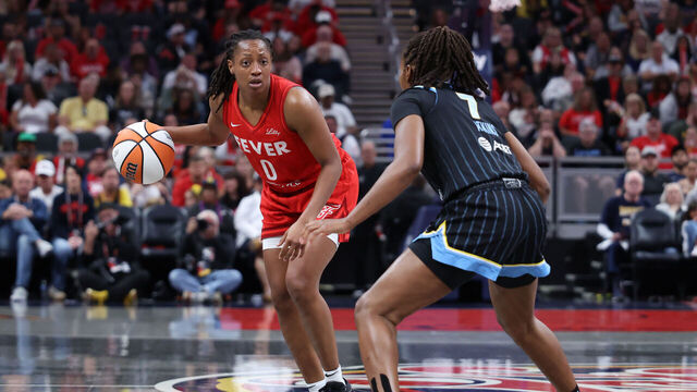 INDIANAPOLIS, INDIANA - SEPTEMBER 05: Kelsey Mitchell #0 of the Indiana Fever brings the ball up the court against Ariel Atkins #7 of the Chicago Sky in the first quarter at Gainbridge Fieldhouse on September 05, 2025 in Indianapolis, Indiana.
