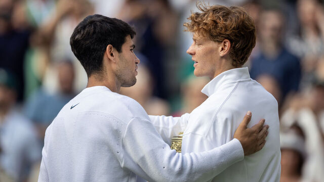 LONDON, ENGLAND - JULY 13: Jannik Sinner of Italy with the winners trophy is congratulated by Carlos Alcaraz of Spain, at the trophy presentations after the Gentlemen's Singles Final on Centre Court during the Wimbledon Lawn Tennis Championships at the All England Lawn Tennis and Croquet Club at Wimbledon on July 13th, 2025, in London, England.