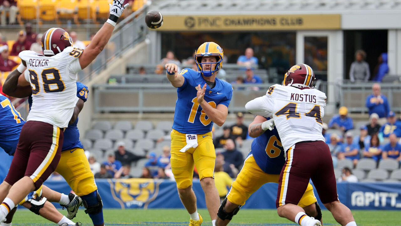 PITTSBURGH, PA - SEPTEMBER 06: Pittsburgh Panthers quarterback Eli Holstein (10) throws a pass as Central Michigan Chippewas defensive lineman Jonathan Decker (98) and Central Michigan Chippewas defensive lineman Kade Kostus (44) apply pressure during the second quarter of the college football game between the Central Michigan Chippewas and Pittsburgh Panthers on September 6, 2025, at Acrisure Stadium in Pittsburgh, PA.