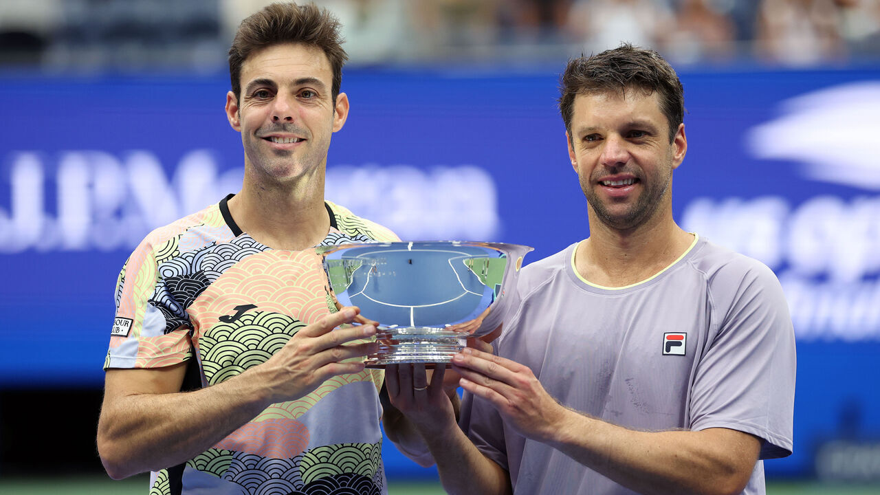 NEW YORK, NEW YORK - SEPTEMBER 06: (L-R) Marcel Granollers of Spain and Horacio Zeballos of Argentina pose with their trophies after defeating Neal Skupski of the United Kingdom and Joe Salisbury of the United Kingdom during their Men's Doubles Final match on Day Fourteen of the 2025 US Open at USTA Billie Jean King National Tennis Center on September 06, 2025 in New York City.